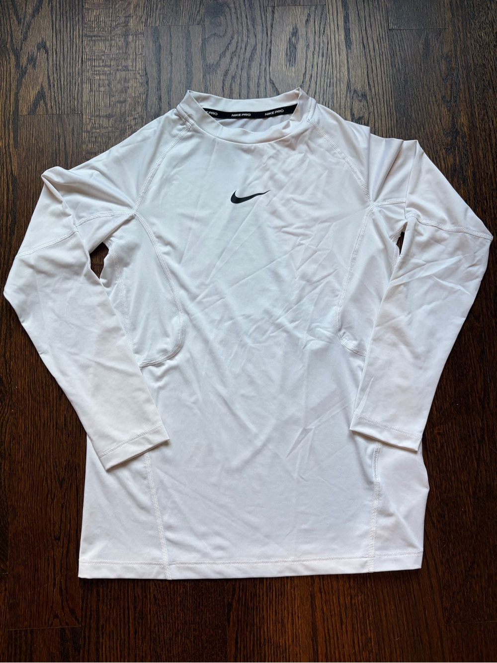 Nike White Long-Sleeve Athletic Tee with Black Swoosh